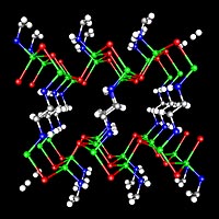 The crystal structure of -ZnTe(en)0:5, determined by single-crystal X-ray diffraction. Two-monolayerthick ZnTe slabs are interconnected by ethylenediamine (C2N2H8) molecules bonded to zinc atoms. Zn-Green, Te-Red, N-Blue,and C-Gray. Hydrogen atoms are omitted for clarity. 