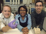 From left, Broad Institute postdoctoral associate Kris Wood, Bayer Professor of Chemical Engineering Paula Hammond and chemical engineering graduate student Dan Schmidt show the thin film they have developed. The film releases drugs and other chemical agents upon application of a small electrical field.