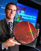 Tom Kilroy, vice president and general manager of Intel's Digital Enterprise Group, displays a wafer from Intel's new Xeon 7400 Processor family, formerly code-named Dunnington, Monday, September 15, 2008, at a news conference in San Francisco. Intel today announced the availablity of seven high-end server processors, including the world's first six-core, x86 chip under the Intel Xeon 7400 Processor Series moniker. (Photo for Intel by Court Mast)