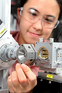 Argonne scientist Karena Chapman examines the diamond anvil pressure cell at the Advanced Photon Source. 