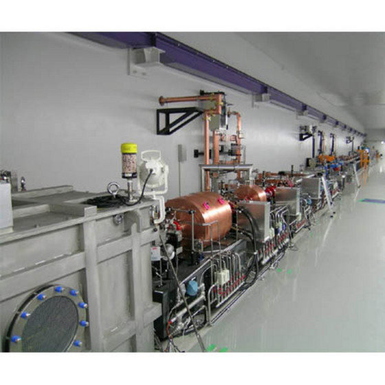 Figure 1: A view at the beam hall of the FEL test facility. The electron gun is contained in the grey box on the left.