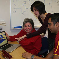 Professor Alice Parker, left, discusses the animation of a synaptic connector with graduate students Chih-Chieh Hsu, center, and Jonathan Joshi.

Photo/Diane Ainsworth