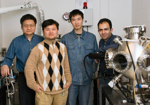TEAM NANOTUBE - Members of UNLs Laser Assisted Nano-Technology Lab team who created self-assembling carbon nanotubes are (from left): professor Yongfeng Lu; post-doctoral researcher Yunshen Zhou; and graduate students Wei Xiong and Masoud Mahjouri-Samani. Photo by Greg Nathan/University Communications.