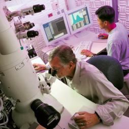 ASU School of Materials professor Ray Carpenter (at left) is pictured doing research with Ph.D. student Young-Chul Kim , using a high- resolution analytical transmission electron microscope at ASUs J.M. Cowley Center for High Resolution Electron Microscopy. The center will be home to a new state-of-the-art aberration-corrected transmission electron microscope.