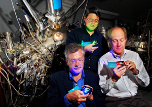 Sandia researchers Jerry Simmons (far left), Michael Coltrin, and Jeff Tsao (standing behind) check out solid-state lighting technologies