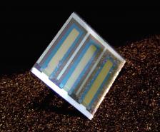 An organic photovoltaic cell on glass. The goal for UA scientists is to understand and control the interfaces in these devices at nanometer-length scales (less than 1/100,000 the thickness of a human hair) to enable the development of long-lived solar energy conversion devices on tough, flexible and extremely low-cost plastic substrates. Photo courtesy Neal Armstrong.