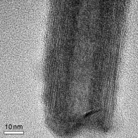 Nanotubes of tin disulfide were fabricated from SnS2 nanoflakes by the vapor-liquid-solid process using bismuth nanodroplets as a catalyst. The SnS2 reagent in the gas phase preferentially adsorbs onto the bismuth particles; upon cooling, nucleation and growth of SnS2 nanotubes occurs (see HRTEM image). Annealing the nanotubes results in the formation of SnS2/SnS superlattices.
