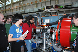 Khiza Mazwi, a student from the University of Southern California, replaces a sample in the spin echo spectrometer while other participants in the NCNR summer school look on.

Credit: Boutin, NIST
