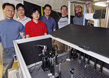 Research team members stand with equipment used for gyromagnetic imaging of gold nanostars. From left are graduate students Hyon-Min Song, Qingshan Wei and Dongmyung Oh; chemistry professor Alexander Wei; graduate student Jacob Hale; and associate professor of physics Kenneth Ritchie. (Purdue University photo/Andrew Hancock)