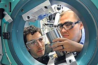 University of Chicago scientist Rafael Jaramillo and Argonne scientist Yejun Feng study the element chromium at the Advanced Photon Source, one of the Argonne facilities to be upgraded with funds from the Recovery Act.