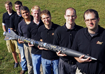 Purdue is working with NASA, the Air Force Office of Scientific Research and Pennsylvania State University to develop a new type of rocket propellant made of a frozen mixture of water and "nanoscale aluminum" powder. The propellant, called ALICE, is more environmentally friendly and could be manufactured on the moon, Mars and other water-bearing bodies. Holding a rocket launched earlier this year using the propellant, from left, are: mechanical engineering undergraduate student Cody Dezelan, mechanical engineering graduate student Tyler Wood, mechanical engineering professor Steven Son, aeronautics and astronautics graduate student Mark Pfeil, mechanical engineering doctoral student Travis Sippel, aeronautics and astronautics research assistant professor Timothe Pourpoint, and postdoctoral researcher John Tsohas. (Purdue University photo/Andrew Hancock)

