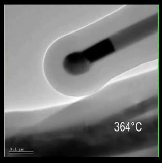 A still shot from the video of the nano test tube experiment conducted in the lab of Brian Korgel, professor in the Department of Chemical Engineering at The University of Texas at Austin.  The video shows gold moving up the length of a germanium nanowire, which was encased in a carbon nano test tube, at high temperature. The image has been magnified 100,000 times and the videos speed has been greatly increased.

