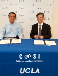 Tak Takimizu (left), president of Photron USA Inc., and Paul S. Weiss, director of the California NanoSystems Institute at UCLA