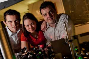 From left, Rice graduate students Sergio Dominguez-Medina, Liane Slaughter and Alexei Tcherniak, co-authors (with Stephan Link and Ji Won Ha) of a new paper investigating the plasmonic properties of nanoparticles as they relate to a century-old theory. Courtesy Jeff Fitlow.