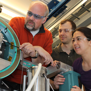Thomas Proffen, left, of Los Alamos National Laboratory, and Peter Chupas and Karena Chapman of Argonne National Laboratory examine the high-energy X-ray beamline 11-ID-B at Argonne's Advanced Photon Source facility.