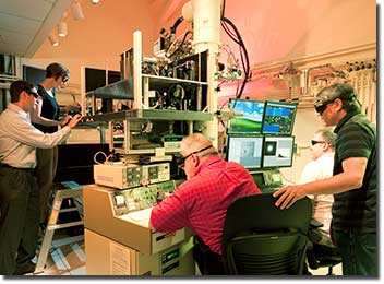 Working with the dynamic transmission electron microscope (DTEM). From left: Bryan Reed, Melissa Santala, William DeHope, Thomas LaGrange, Joseph McKeown.
Photo by Jacqueline McBride/LLNL