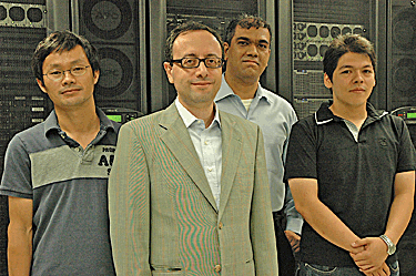Left to right: Chemical and Biological Engineering postdoctoral associate Guowen Peng, Professor Manos Mavrikakis, postdoctoral researcher Rahul Nabar, and PhD student Jeff Herron. Photo by Renee Meiller. 
