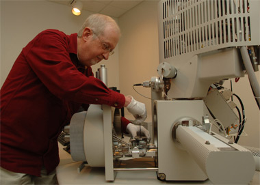 House keeping -- John Bozzola, director of the Integrated Microscopy and Graphics Expertise center at Southern Illinois University Carbondale, works with the Universitys new analytical high-resolution scanning electron microscope. The new, half-million dollar device, paid for by the National Science Foundation, will help many researchers see and study objects down to 1 nanometer in size while providing startling 3-D images as well. (Photo by Jeff Garner)