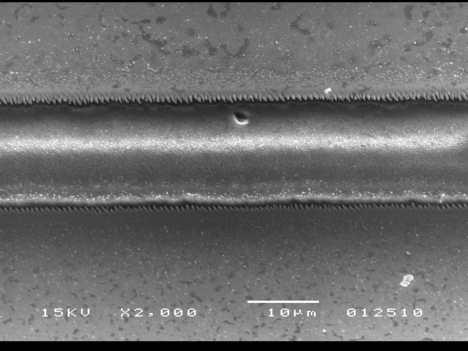 This image, taken with a scanning electron microscope, shows a microchannel that was created using an ultrafast-pulsing laser.
(Purdue University School of Mechanical Engineering image/Yung Shin)