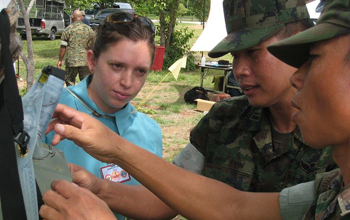 DayOne Response, a student team funded by the National Collegiate Inventors and Innovators Allianc NCIIA in 2009, has developed a water storage/purifcation system for use in disaster relief. Here, DayOne founder and waterbag inventor Tricia Compas demonstrates the waterbag to members of the Thai military. The waterbag was tested in a joint exercize between U.S. and Thai military forces in 2010.

Credit: "DayOne Response"