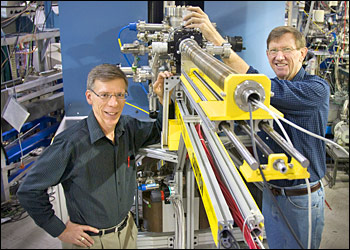 Dan Fischer (left) and Raymond Browning show off the prototype of the Vector Potential Photoelectron Microscope.