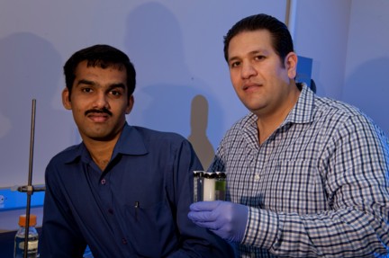 Rice University postdoctoral researcher Tharangattu Narayanan, left, and graduate student Jaime Taha-Tijerina, lead authors of a new ACS Nano paper on nanoparticle-infused transformer oils, show vials of the oils they say are up to 80 percent more efficient in keeping transformers cool.
(Credit Jeff Fitlow/Rice University)