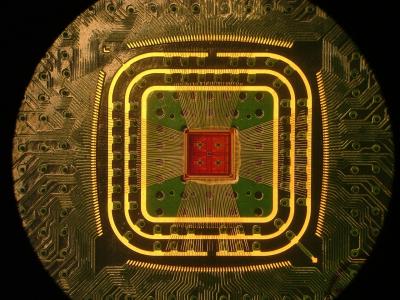 This is a photograph of the Columbia Engineering team's custom multichannel CMOS preamplifier chip, attached to a circuit board with thin gold wirebonds.

Credit: Columbia Engineering