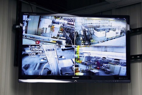 A control room screen offers images of the magnet area.