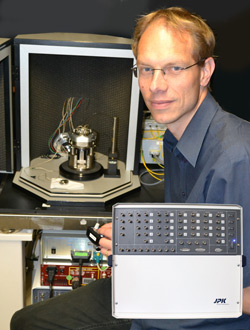 Dr Bart Hoogenboom from UCL with his advanced AFM set up controlled by JPK's Vortis system (insert)