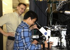 Dr. Anton Malko (left) works in the lab with Hue Minh Nguyen, a physics graduate student who has assisted in the research.