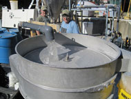 Chemical engineer Paul Edmiston demonstrated Osorb, a revolutionary new type of material that can clean water from oil spills, detect explosives and even treat the subsurface of Superfund sites, during a webcast hosted by NSF last year. Pictured are Dr. Stephen Jolly and Doug Martin of ABSMaterials showing clean water being passed over a vibratory separator after treatment with Osorb. Find out more in this webcast video.
Credit: Sarah Pollock, ABSMaterials