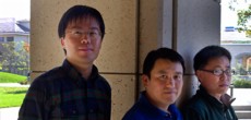 Professor Shanhui Fan (center), post-doctoral scholar Zongfu Yu (right), both of the Stanford School of Engineering, and doctoral candidate Kejie Fang (left), of the Department of Physics, have used synthetic magnetism to control the flow of light at the nanoscale. Photo: Norbert von der Groeben.