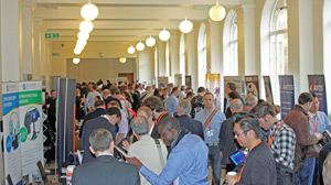 Delegates take time out at the exhibition.
