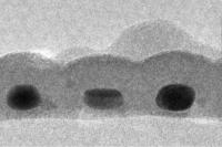 This is a cross-section of the record-thin absorber layer showing three gold nanodots, each about 14x17 nanometers in size and coated with tin sulfide.

Credit: Carl Hagglund, Stanford Unibversity