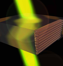 This graphic depicts a device created using "negatively refracting metamaterials" that could bring advances in applications including sensing, imaging, data storage, solar energy and optics. Purdue researchers are working on a range of options to overcome a fundamental obstacle in commercializing the materials. The small spheres at right represent a lattice of "meta-atoms" carefully designed and fabricated to produce a high-performance device.Birck Nanotechnology Center/Purdue University