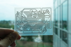 A single-sided wiring pattern for an Arduino micro controller was printed on a transparent sheet of coated PET film.
