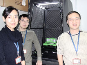 Professor Yi Cao, right, and two of his students with the JPK ForceRobot system in the Institute of Biophysics at Nanjing University. 
