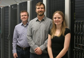 Right to left: Prof. David Hawthorn, Prof. Roger Melko, and Lauren Hayward. They are pictured in front of  Waterloos SHARCNET supercomputer which they used to perform the calculations.