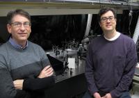 Andrew H. Marcus, left, and Mark C. Lonergan, both of the University of Oregon, stand by UO spectroscopy equipment that was adapted to study photon interactions in photocells that used lead-sulfide quantum dots as photoactive semiconductor material.

Credit: University of Oregon