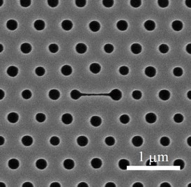 This image shows a top view of the group's nanolaser, in which the center narrow slot (horizontal line) is the main part of the sensor. The periodic holes form a photonic crystal, and although the size of the holes appears to fluctuate they've been intentionally modified so the laser's emission is effectively extracted to the top.
CREDIT: Toshihiko Baba/Yokohama National University