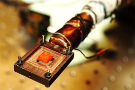 This is a pure perovskite crystal, orange in colour, is mounted on a cryostat.
CREDIT: U of T Engineering
