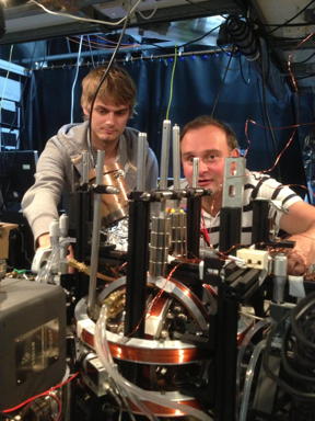 Winfried Hensinger (right) and Dr. Seb Weidt are freezing individual atoms using microwaves.
CREDIT: University of Sussex