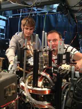 Winfried Hensinger (right) and Dr. Seb Weidt are freezing individual atoms using microwaves.
CREDIT: University of Sussex