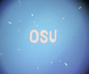 The orange color in the letters 'OSU' is produced from 'quantum dots' viewed under a microscope, as they absorb blue light and emit the light as orange -- an illustration of some of the potential of new technology being developed at Oregon State University.
CREDIT: Image courtesy of Oregon State University