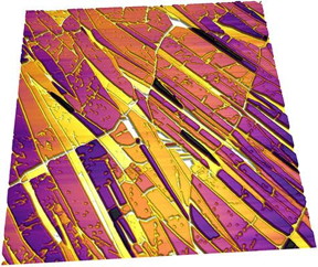 Topography image shown in 3D of crystalline domains in a non-planar phthalocyanine film grown on a highly ordered pyrolitic graphite substrate. Phthalocyanine is of interest for potential applications as an organic semiconductor, 25 μm scan. Image courtesy of Luke Rochford, University of Warwick.