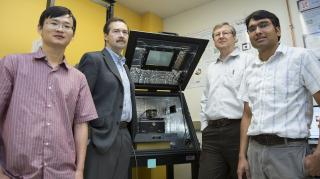 (From left) Haidong Lu, postdoctoral researcher; Alexei Gruverman, professor of physics and astronomy; Evgeny Tsymbal, professor of physics and astronomy; and Tula R. Paudel, research assistant professor. The scientists are affiliated with the Nebraska Center for Materials and Nanoscience. Tsymbal is director of the NSF-supported Materials Research Science and Engineering Center at UNL. Troy Fedderson/University Communications