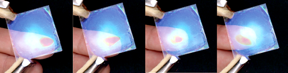 These images depict how the photonic sensor translates finger movements into color changes, as the photonic crystal reacts to the change in local humidity caused by the approach of the finger without direct contact.