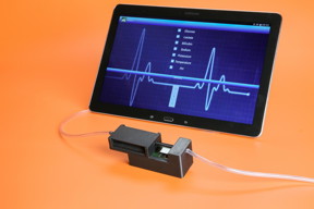 This picture shows a device developed at EPFL that is capable of monitoring in real-time 5 vital substances for patients in ICU. Back: preview of the tablet app designed to monitor the values.
CREDIT: Alain Herzog / EPFL 2015
