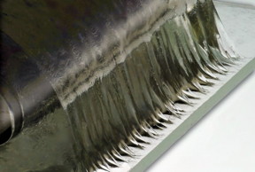 Engineered hydrogel being pulled away from a glass surface. The material shows a property called tough wet adhesion comparable to tendon and bone interface. The wavy edge instability at the interface is a hallmark of strongly adhered soft material on a rigid surface.

Image: Felice Frankel