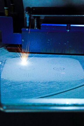 This is the selective laser melting process in action.

Image courtesy of Tim Sercombe/University of Western Australia